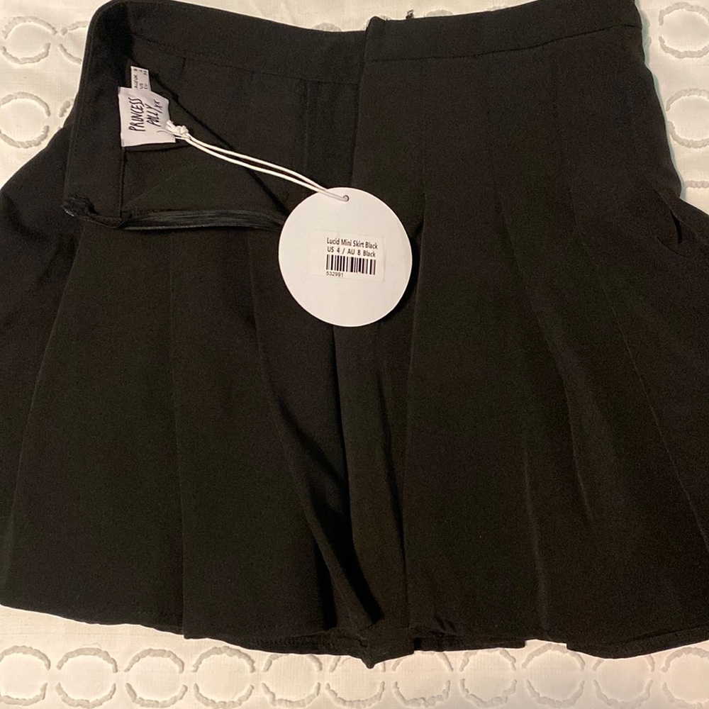 Princess Polly black pleated mini skirt. NWT.